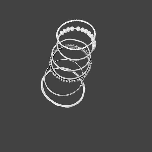 Stack of varoius silver bangle