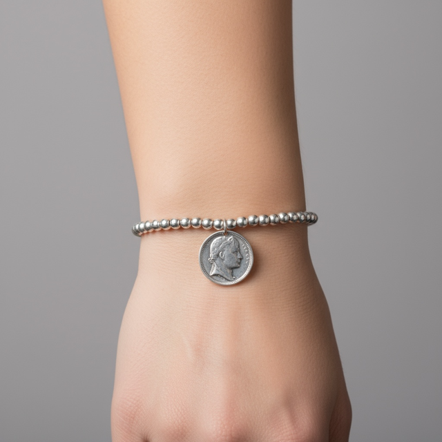 Silver metal beaded pendent with an elegant coin charm - can also be worn as a bracelet