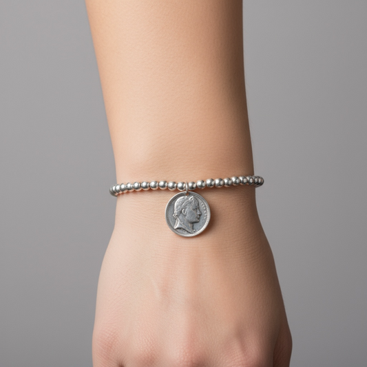 Silver metal beaded pendent with an elegant coin charm - can also be worn as a bracelet