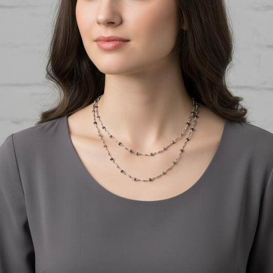 Long twisted metal chain with black beads to enhance the look
