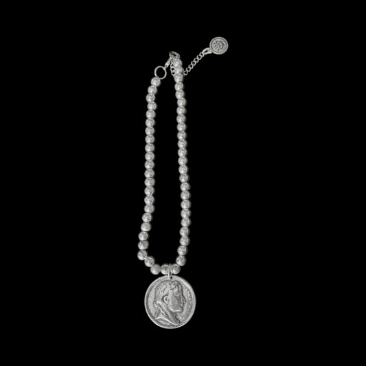 Silver metal beaded pendent with an elegant coin charm - can also be worn as a bracelet