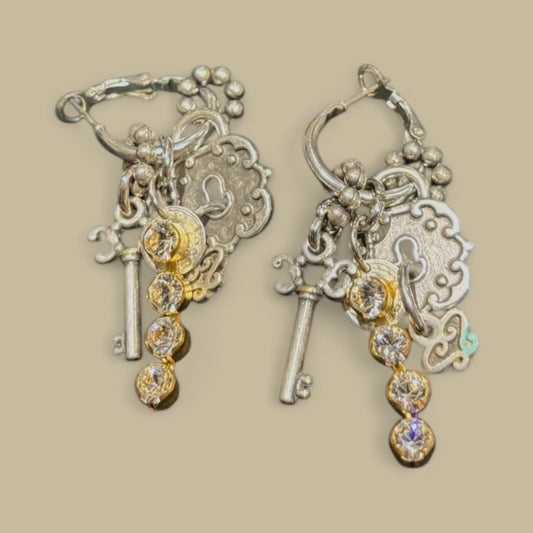 Dangly earring with selected charms and rhinestone