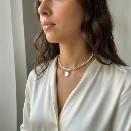 Silver beaded pendent with heart shaped charm