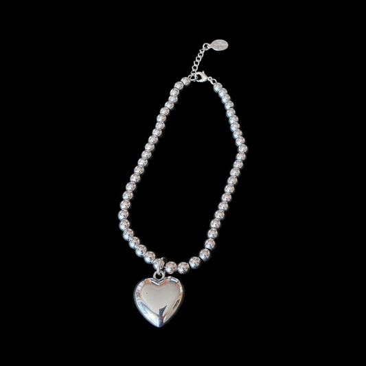 Silver beaded pendent with heart shaped charm