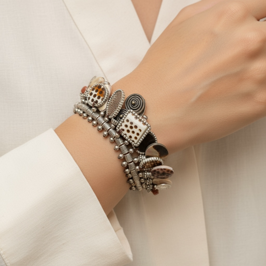 Metal bracelet with magnetic clasp with layered glass charms