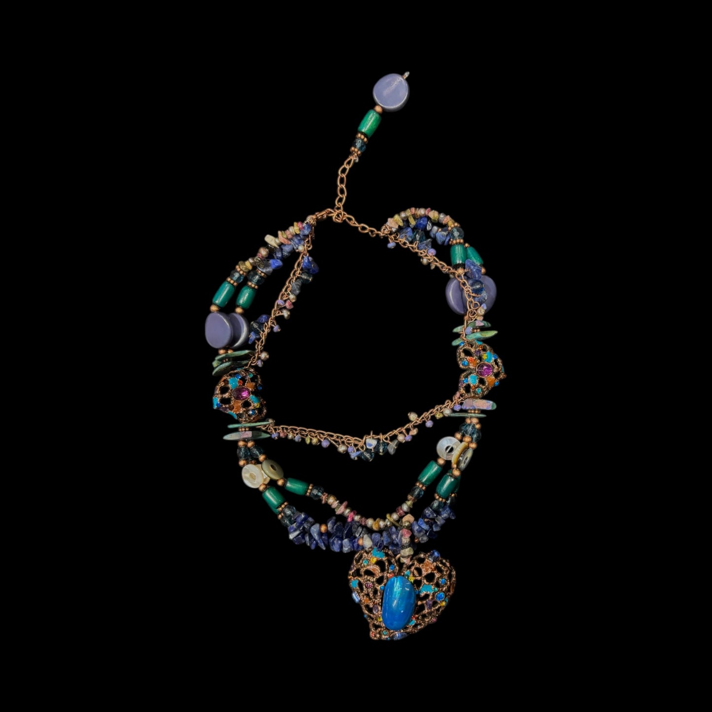 Multi coloured layered necklace in shades of blue,green and brown