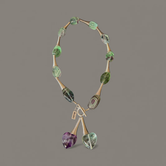 Beautiful twisted corn metal design with green and purple Beads