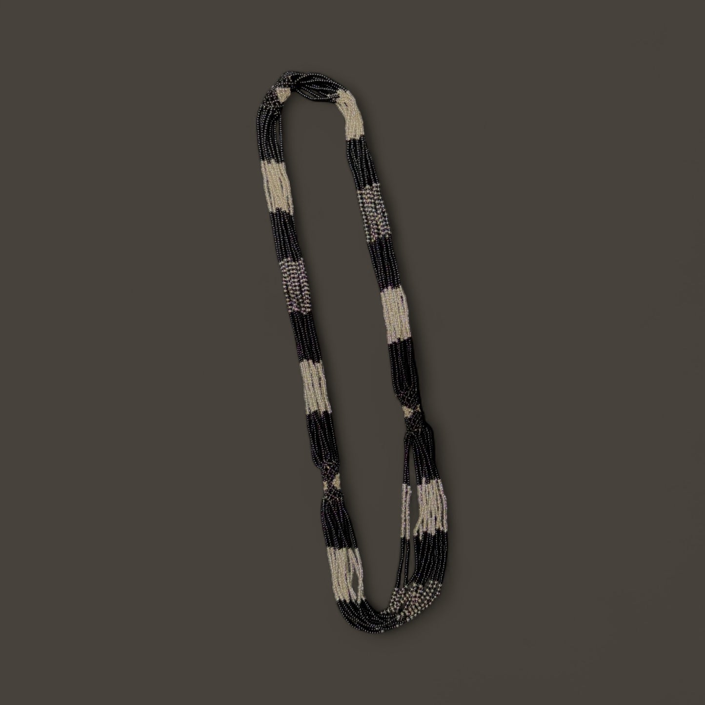 String of black and white beaded necklace