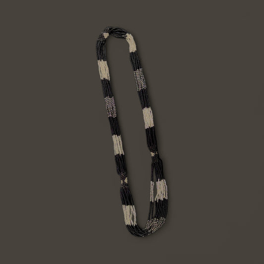 String of black and white beaded necklace