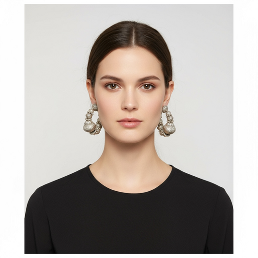 Half hoop silver  piearced earring featuring intricatley degined spherical forms