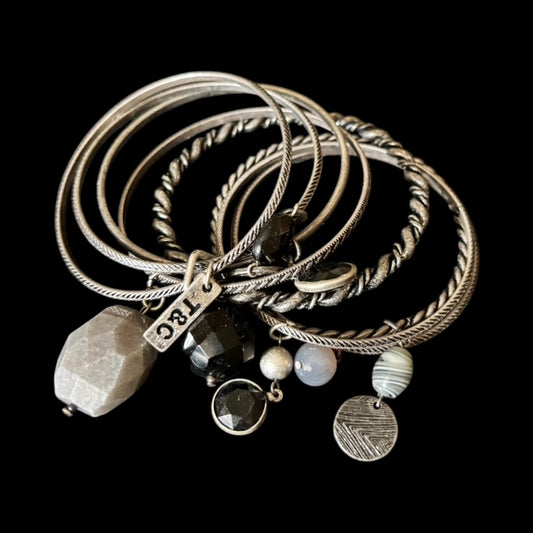 Stack of Sliver Bangles with unique design and stones