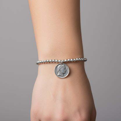 Silver metal beaded pendent with an elegant coin charm - can also be worn as a bracelet