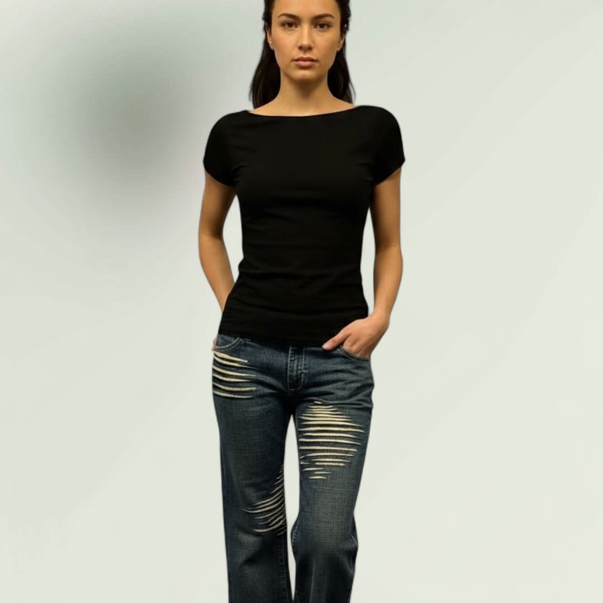 model wearing the sleek black to with hand made jeans 