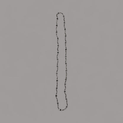 Long twisted metal chain with black beads to enhance the look