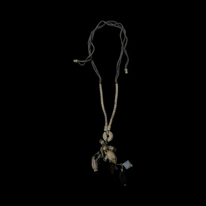 Beaded  string necklace featuring collection of unique stones