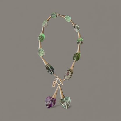 Beautiful twisted corn metal design with green and purple Beads